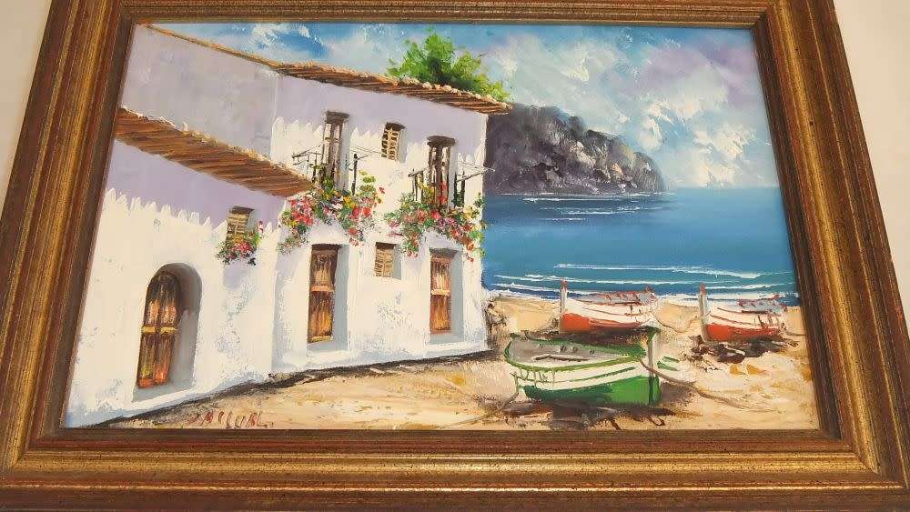 An original signed oil on board Spanish coastal village painting by Spanish artist Juan Pascual