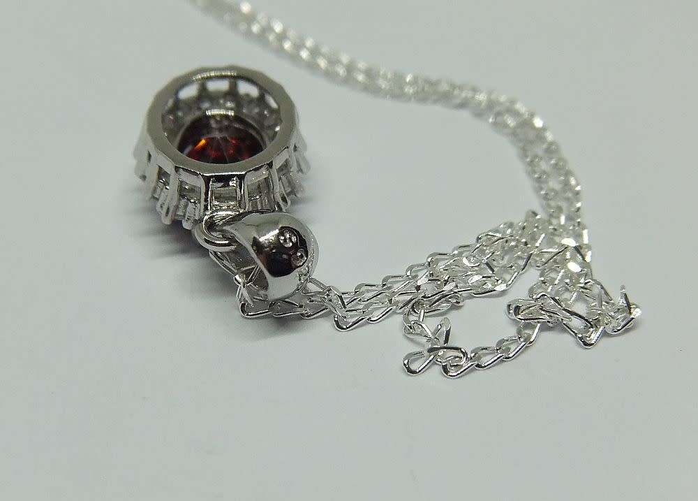 AN ELEGANT FACETED RED AND CLEAR CZ SET STERLING SILVER PENDANT WITH STERLING SILVER NECKLACE