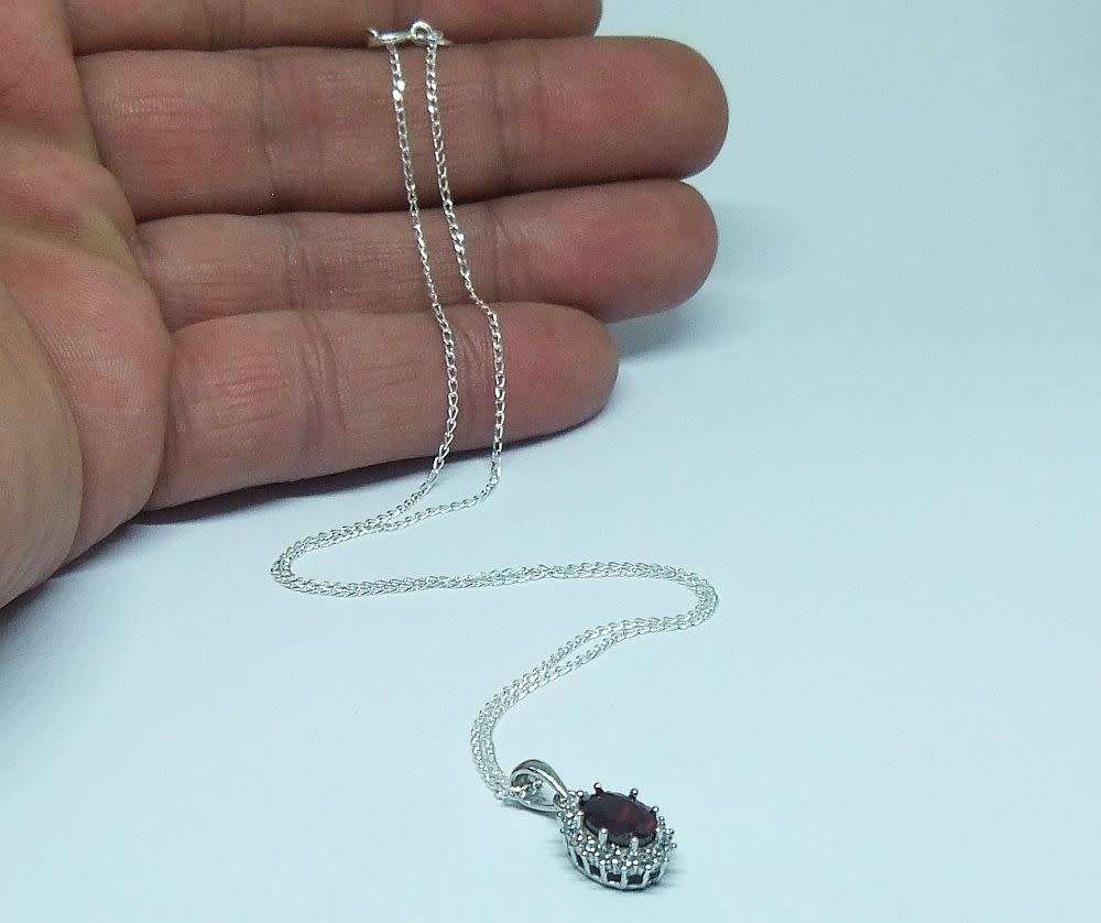 AN ELEGANT FACETED RED AND CLEAR CZ SET STERLING SILVER PENDANT WITH STERLING SILVER NECKLACE