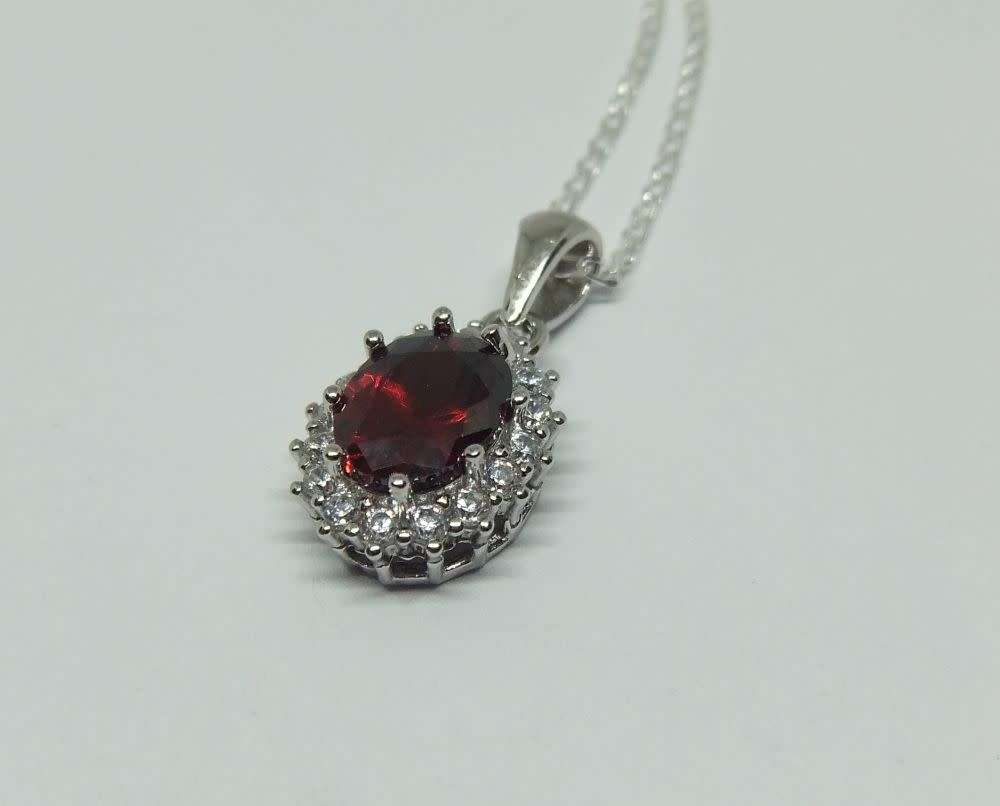 AN ELEGANT FACETED RED AND CLEAR CZ SET STERLING SILVER PENDANT WITH STERLING SILVER NECKLACE