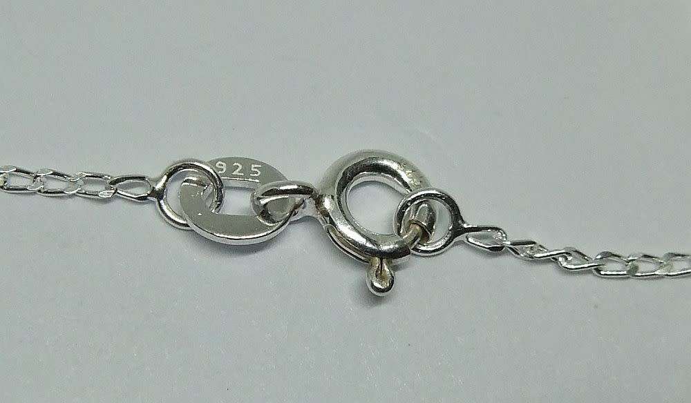 AN ELEGANT FACETED RED AND CLEAR CZ SET STERLING SILVER PENDANT WITH STERLING SILVER NECKLACE