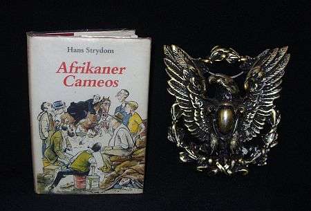 2 AFRICANA ITEMS - SIGNED FIRST EDITION AND BRANDWAG EAGLE
