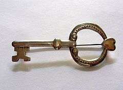 A lovely vintage sterling silver key brooche