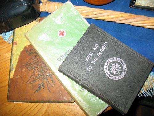 3 old books on first aid