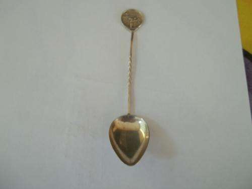 Hallmarked silver spoon with tennis player