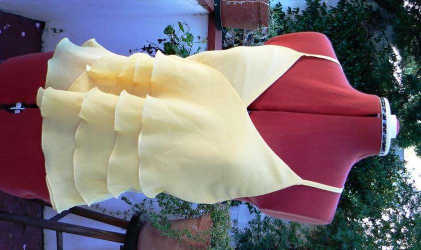 Light yellow Monsoon halterneck top with layered detailing, size M