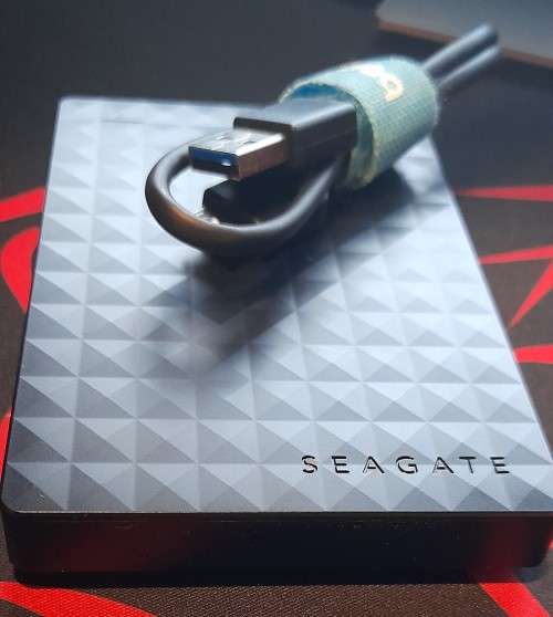 Seagate 1TB - Expansion Super Slim Portable Drive `Like New` with cable and New Protection Sleeve.