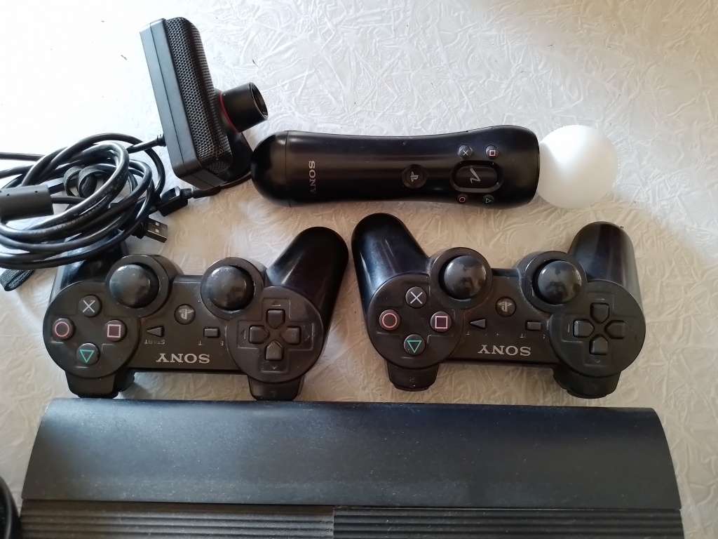 Ps3 Super Slim, remotes, games and Skylanders set