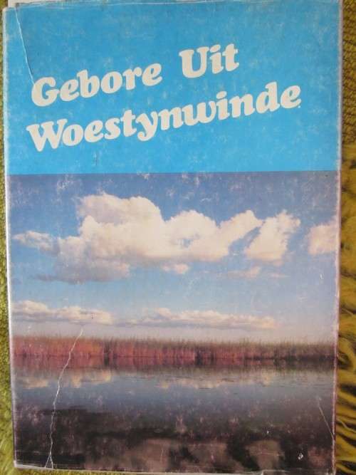 Gebore uit Woestynwinde-Nigrini- stofomslag redelik verweerd