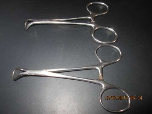 COLLECTIBLE ..PAIR OF SURGICAL CLAMPS..STAINLESS STEEL