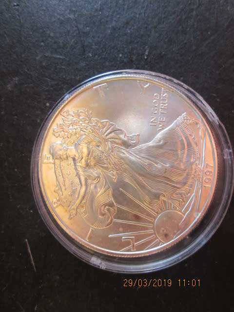 STUNNING UNC 1997 EAGLE/1 DOLLAR 1OZ FINE SILVER IN CAPSULE