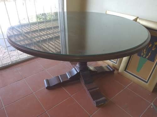 Solid oak round pedestal dining room table, with a glass table top cover.