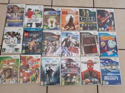 Nintendo Wii c/w remote controls and  18 x games