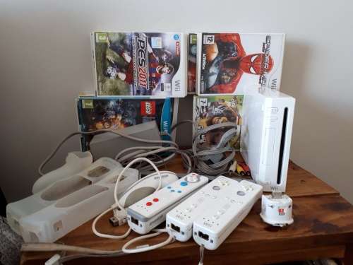 Nintendo Wii c/w remote controls and  18 x games