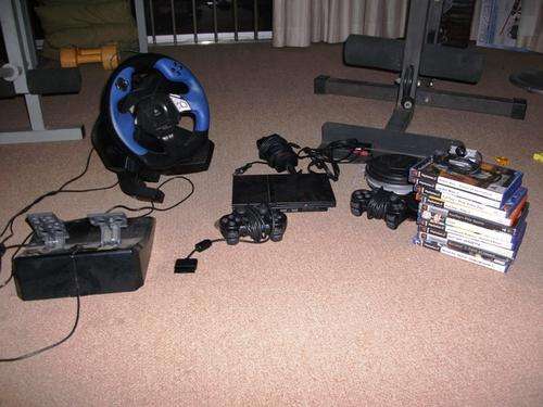 PS2 Console + Streering with pedals + 2 Controls and 10 Games