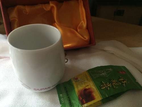 Beautiful Asian Tea cup with authentic asian tea boxed; in silk