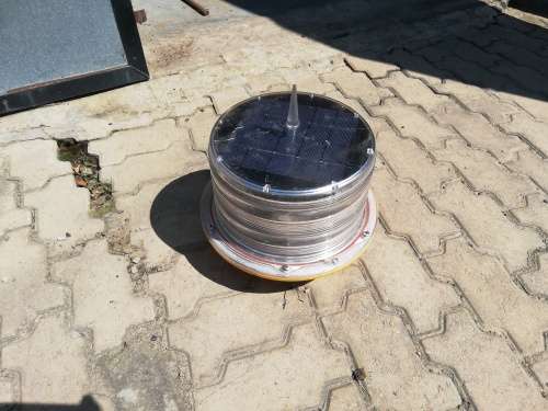 Solar powered radio tower strobe light