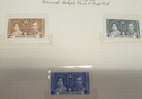 1937 Coronation stamp album + stamps.
