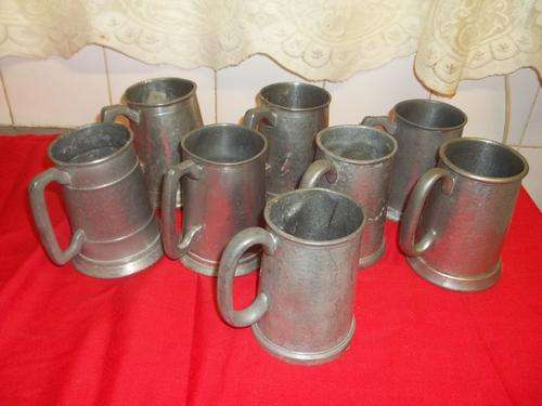 8 PEWTER MUGS ON AUCTION