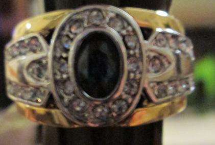 9ct gold ring with blue center stone and smaller white stones
