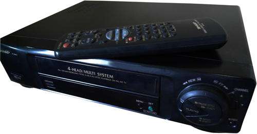 SHARP VCR Machine with VHS Movies