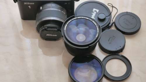 Nikon 1 J1 Mirrorless Digital Camera with 10-30mm VR Zoom Lens¿