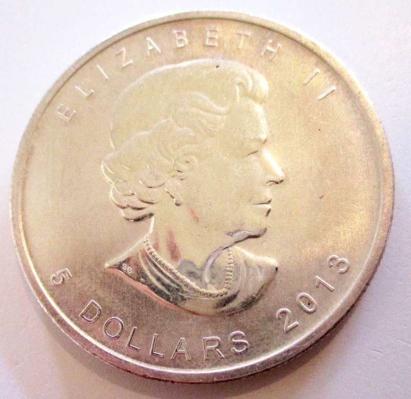 A CANADIAN FINE 1 OZ  5 DOLLAR 2013 --,999 SILVER PURITY--In an unsealed capsule