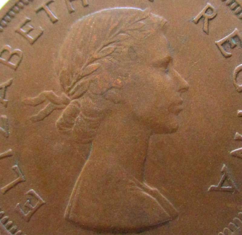 A 1954 SOUTH AFRICA PENNY---Very good detail but has a curl on the rim