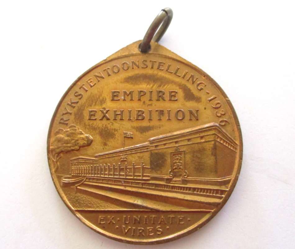 A LOT OF COMMEMORATIVE COINS AND MEDALLIONS AND A SPOON MADE FROM A 1942 COIN