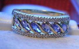 9CT SOLID GOLD REAL TANZANITE & .30 DIAMOND ETERNITY RING