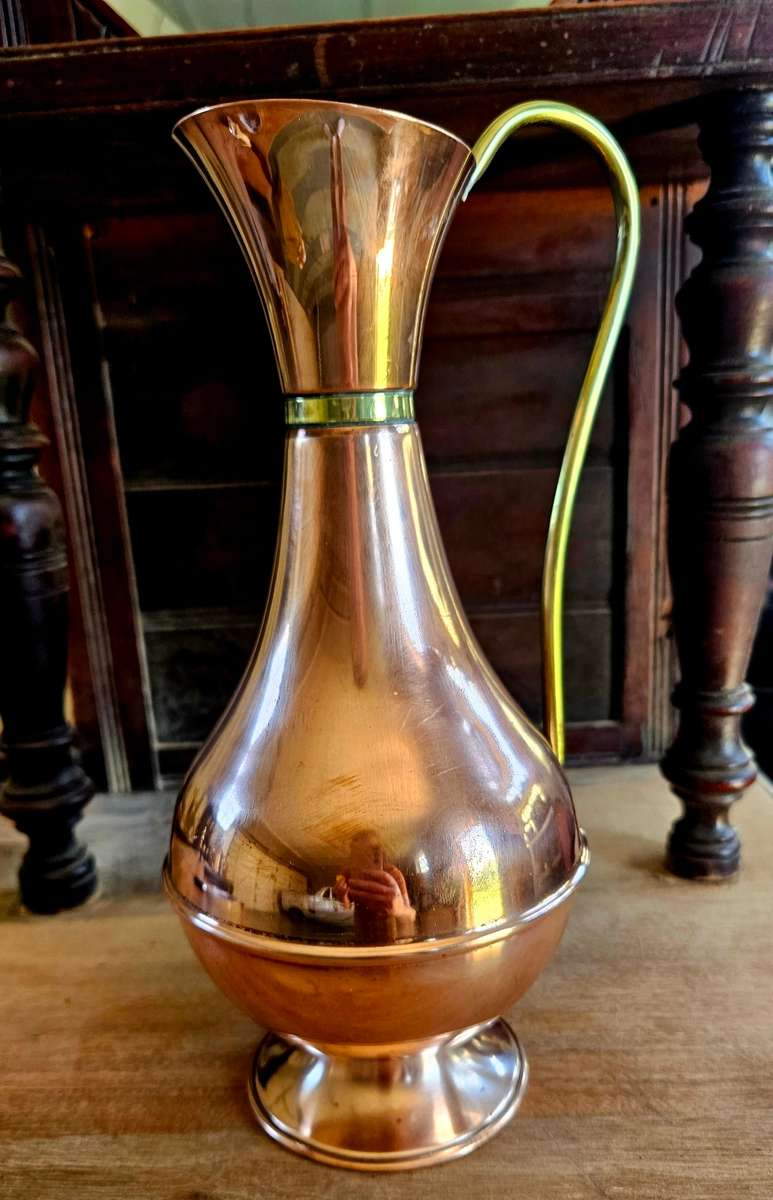 Vintage copper jug with brass rings