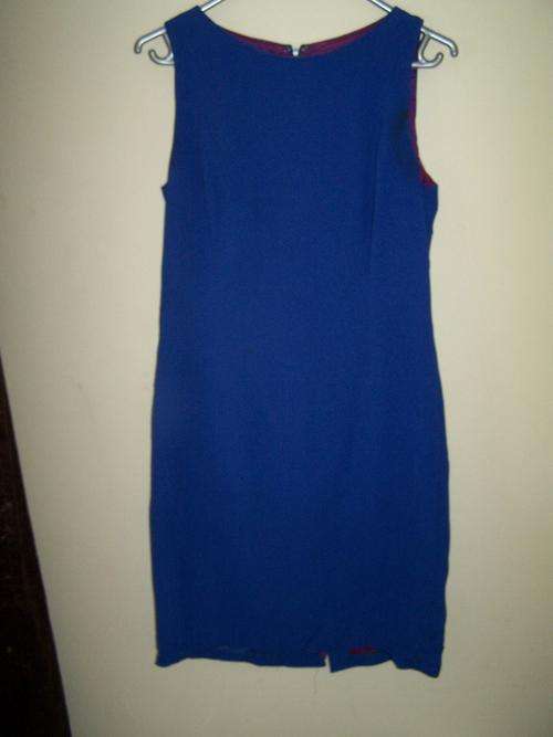 Size 8 (but seems bigger) bright blue work dress