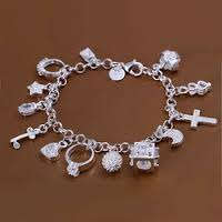 Silver charm bracelet with charms