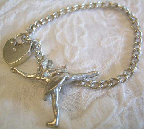 VINTAGE, SILVER, CHILD SIZE, CHAIN WITH A LOCK AND AN ICE SKATING FIGURE OF A W OMAN.