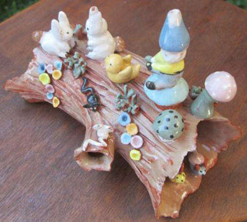 HAND CRAFTED, PAINTED AND GLAZED WOODLAND CREATURES ON A TERRACOTTA POTTERY LOG OF "WOOD"