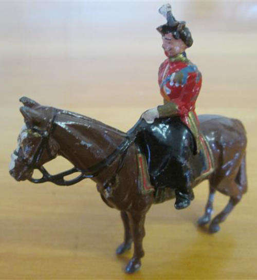 VINTAGE, CAST LEAD FIGURINE OF QUEEN ELIZABETH ON HER HORSE, BRITISH MADE.