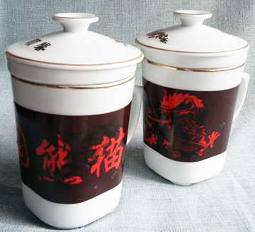 INTERESTING....MATCHING PAIR OF CHINESE HERBAL PORCELAIN MUGS WITH INFUSER AND LID
