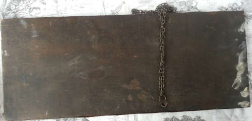 ANTIQUE, RECTANGULAR BEVELED MIRROR SET WITHIN A DECORATIVE PRESSED METAL FRAME