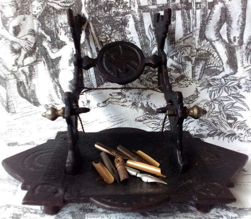 ANTIQUE, DECORATIVE CAST IRON NIB PEN REST, VINTAGE CELLULOID AND BONE DIP PEN