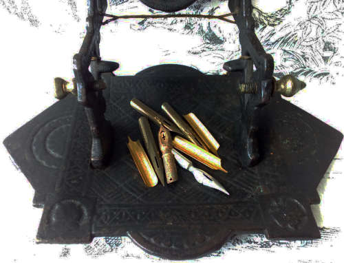 ANTIQUE, DECORATIVE CAST IRON NIB PEN REST, VINTAGE CELLULOID AND BONE DIP PEN