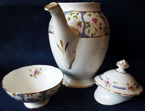 COAL PORT BONE CHINA, PARTIAL DEMITASSE SET IN THE TRELIS ROSE DESIGN