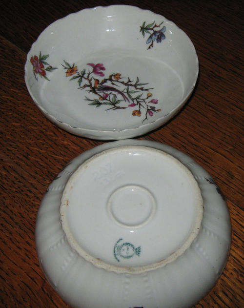 2 sweet dishes circum.13cm  both have one small chip on rim
