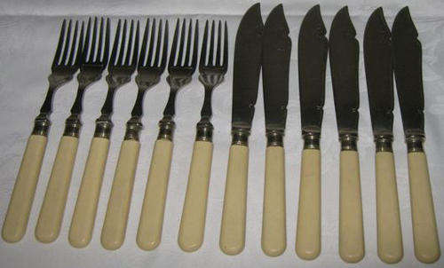 R1.00  SET OF BONE HANDLED, FISH KNIVES ANS FORKS, 6 OF EACH, 12 PIECES, ALL TOLD.