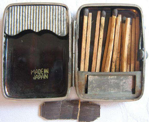 NEARLY ANTIQUE, JAPANESE LACQUERED MATCH HOLDER, WITH SOME OF THE ORIGINAL MATCHES.