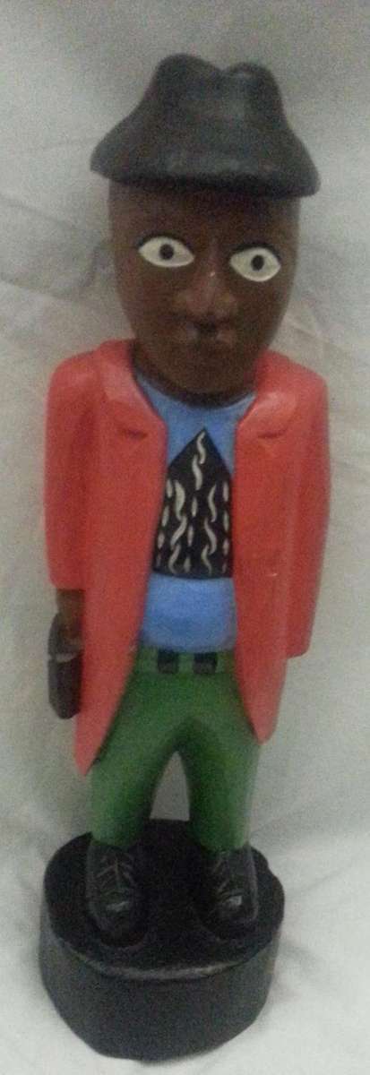 WOODEN CARVED MAN OFF TO THE OFFICE