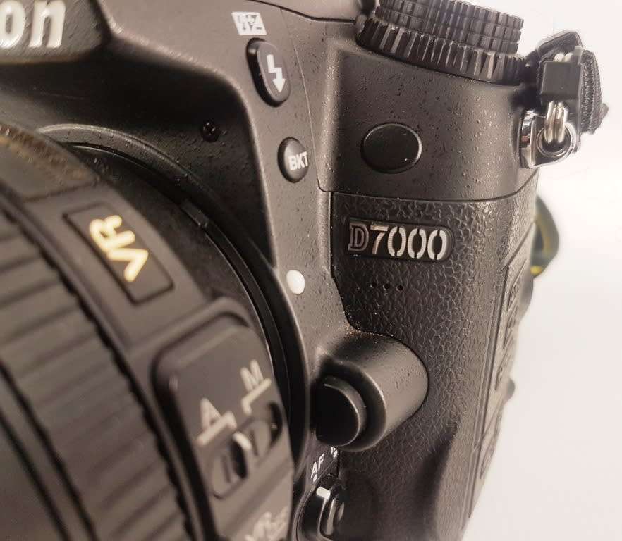 Nikon D7000 Camera Body with AF-S Nikkor 18-105mm 1:3.5-5.6G ED Lens Charger Battery Backpack