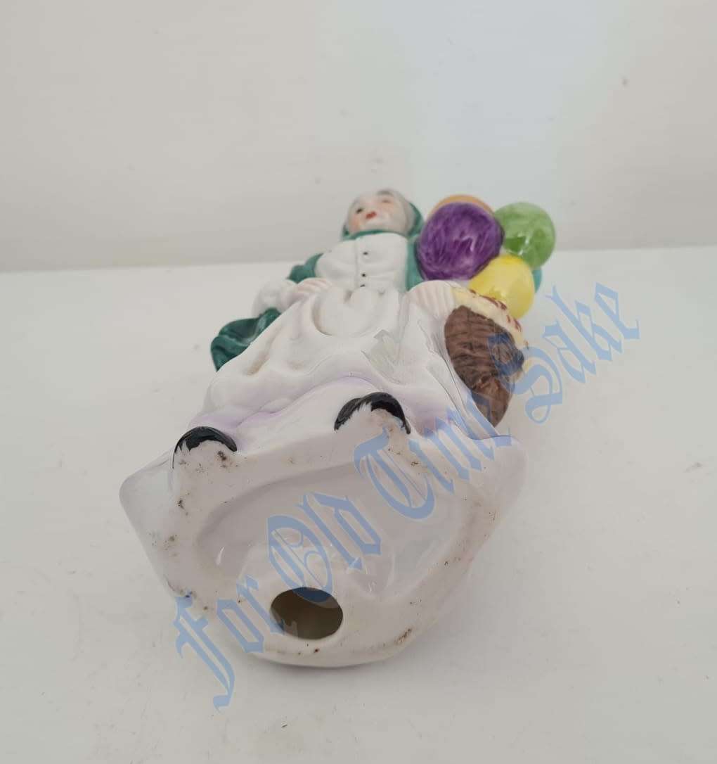 Vintage Porcelain lady with Balloons figure, no markings, she stands 19.5cmtall