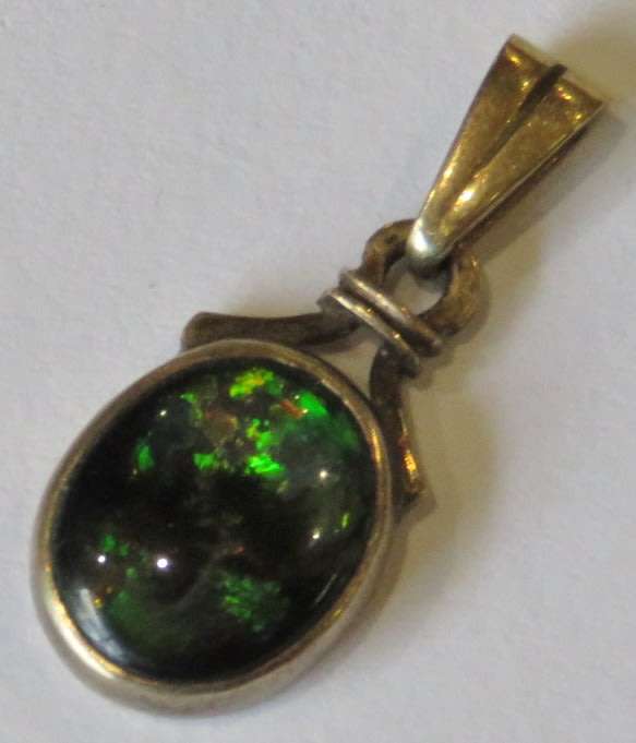 Black opal in 9kt gold setting pendant