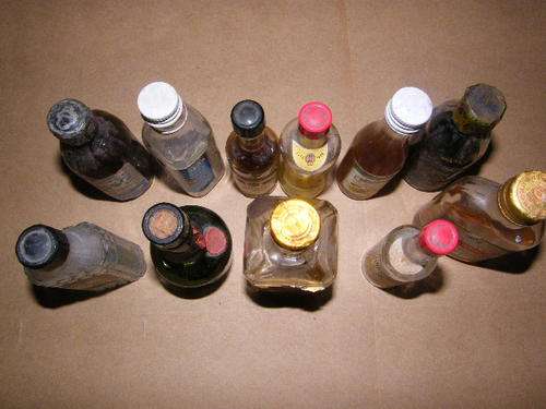 Lot of 11 miniature vintage liquor bottles - as per scan - YOU BID PER BOTTLE TO TAKE ALL