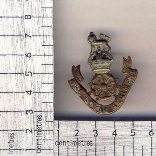 The Loyal Regiment cap badge - one lug missing as per scan